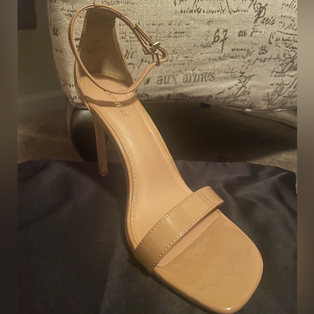 Cute open toe heels worn twice. Shoes come with original shoe bag.